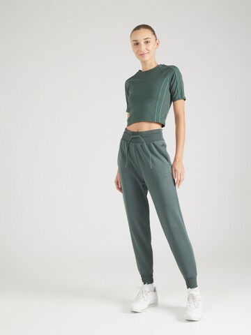 NIKE - Camiseta funcional 'One' en verde