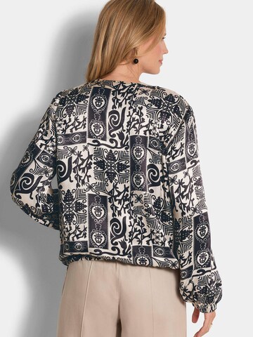 Goldner Tussenjas in Zwart