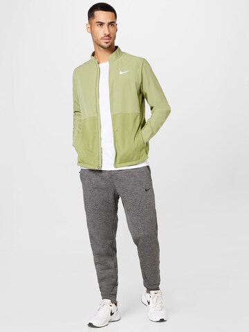 Effilé Pantalon de sport NIKE en gris