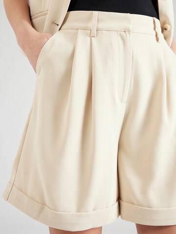 Loosefit Pantaloni con pieghe di ABOUT YOU x Iconic by Tatiana Kucharova in beige
