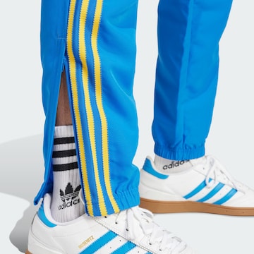 Tapered Pantaloni sport de la ADIDAS ORIGINALS pe albastru