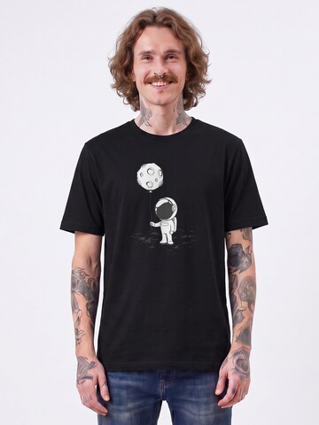 T-Shirt 'Kleiner Astronaut Mit Luftballon' Watapparel en noir : devant