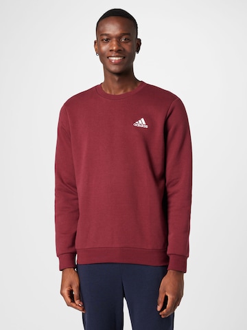 ADIDAS SPORTSWEAR - Sweatshirt de desporto 'Essentials' em vermelho: frente