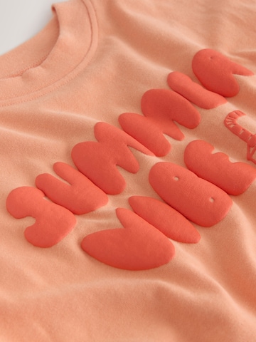 T-Shirt Next en orange