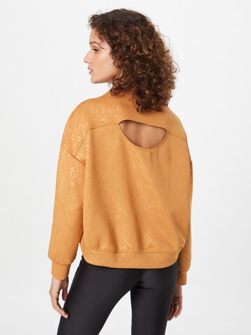 PUMA Athletic Sweatshirt 'Fashion Luxe Embossed' in Brown