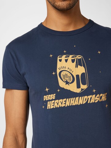 Derbe Shirt 'Herrenhandtasche' in Blauw