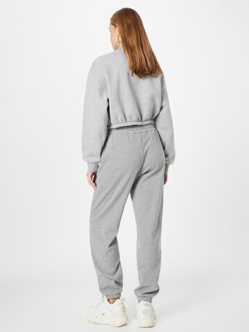 Tapered Pantaloni sportivi di Juicy Couture Sport in grigio