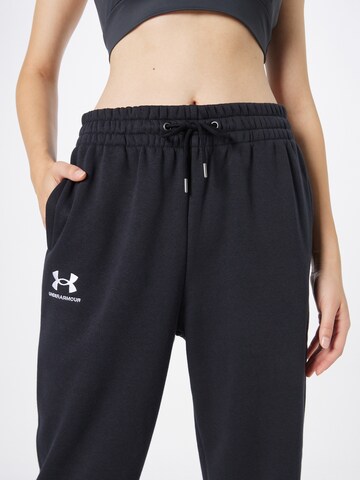 UNDER ARMOUR Tapered Παντελόνι φόρμας 'Essential' σε μαύρο