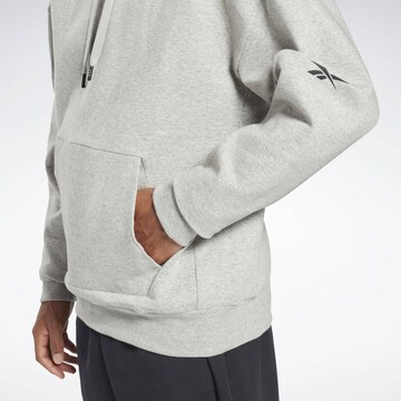 Reebok - Sweatshirt de desporto em cinzento