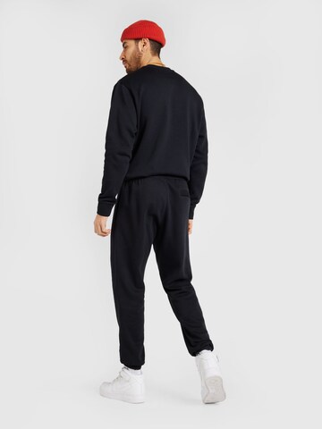 Nike Sportswear Zúžený Kalhoty 'CLUB' – černá