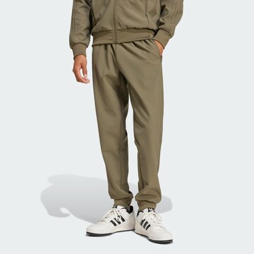 ADIDAS ORIGINALS Tapered Trousers in Green: front