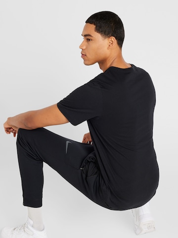 Nike Sportswear Póló 'SWOOSH' - fekete