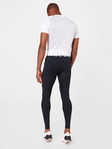 UNDER ARMOUR Skinny Sports trousers in Black