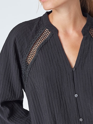Chemisier 'Shina' co'couture en noir