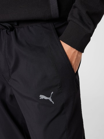 PUMA - Tapered Calças de desporto 'Studio' em preto