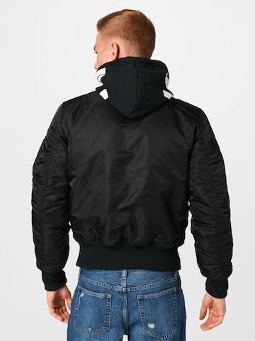 ALPHA INDUSTRIES Välikausitakki värissä musta