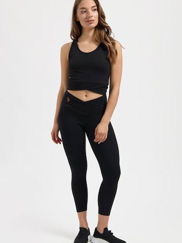 Urban Goddess Yoga & Activewear Sporttop 'Sati Yoga & Pilates' in Schwarz