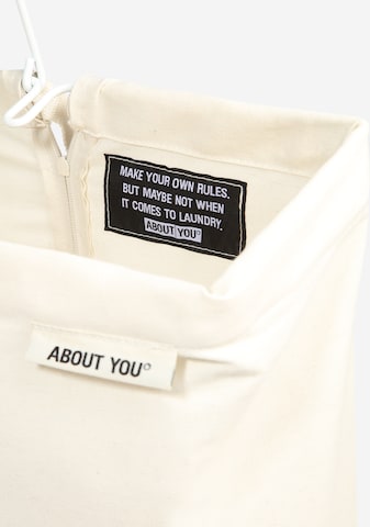 ABOUT YOU Laundry Basket in Beige