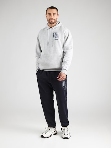 UNDER ARMOUR - Tapered Pantalón deportivo en negro
