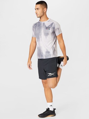 Reebok Regular Sportsbukser 'Strength Graphic 2.0' i svart