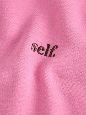 self. - Sudadera en rosa