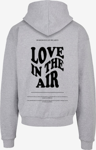 Merchcode Sweatshirt 'Love In The Air' in Grau