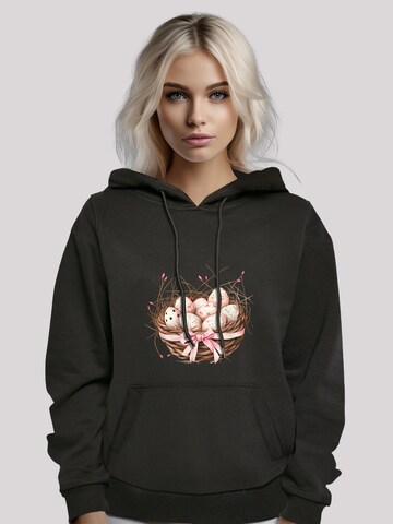 Sweat-shirt 'Osterei Nest Korb Dekor' F4NT4STIC en noir
