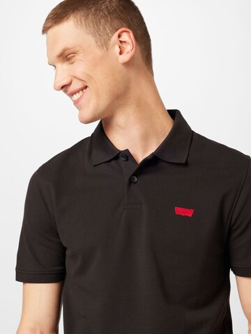 LEVI'S ® Poloshirt 'Housemark' in Schwarz