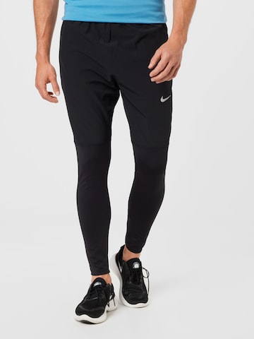 NIKE Slim fit Workout Pants in Black: front