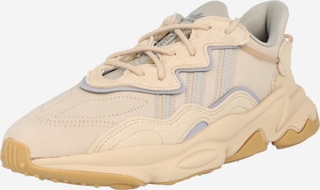 Chaussure de course 'Ozweego' ADIDAS ORIGINALS en beige : devant