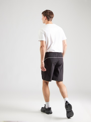 Regular Pantaloni sport de la PUMA pe negru
