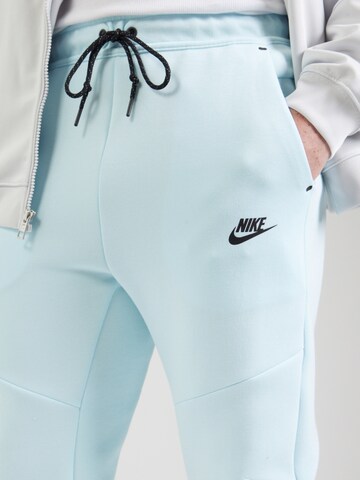 Nike Sportswear Tapered Nadrág 'TCH FLC' - kék