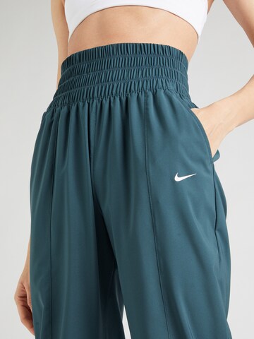 Regular Pantaloni sport 'One' de la NIKE pe albastru