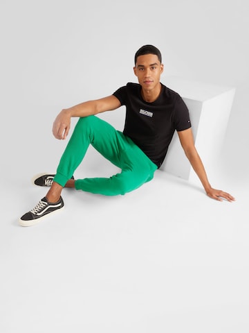 TOMMY HILFIGER Tapered Trousers in Green