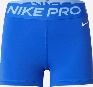 NIKE Sports trousers in Blue: front