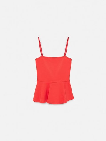 Haut Dilvin en rouge : devant