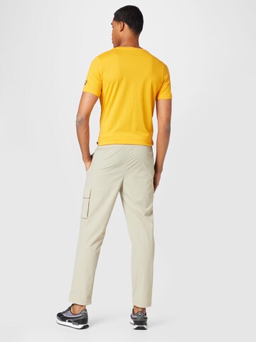 PUMA Regular Workout Pants in Beige