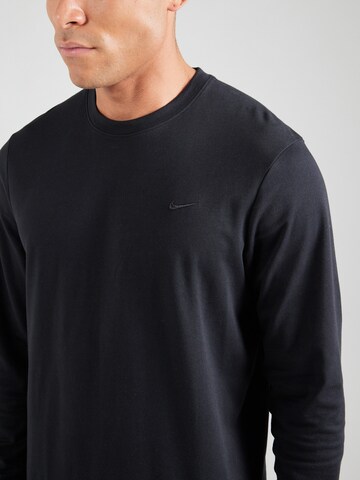 NIKE Λειτουργικό μπλουζάκι 'PRIMARY' σε μαύρο
