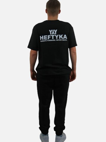 HEFTYKA Regular Sporthose‌ in Schwarz