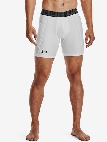 UNDER ARMOUR Skinny Workout Pants in White: front