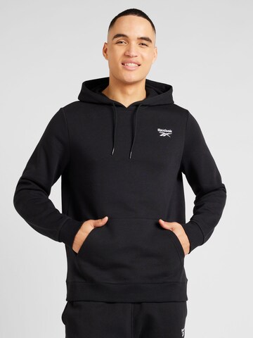 Reebok - Camiseta deportiva en negro: frente