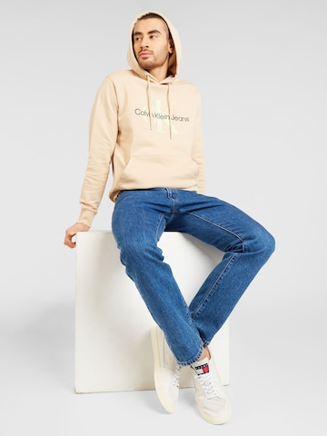 Bluză de molton de la Calvin Klein Jeans pe bej