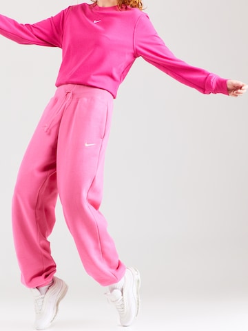 Nike Sportswear Alt kitsenev Püksid 'PHOENIX FLEECE', värv roosa