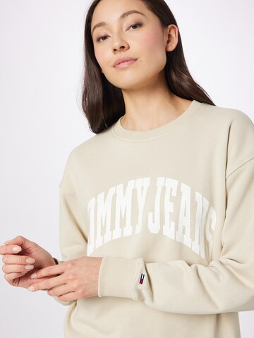 Tommy JeansSweater majica 'College' - bež boja