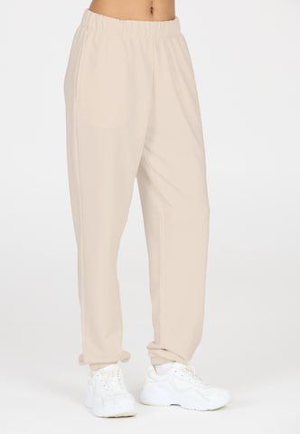 Athlecia Regular Sports trousers in Beige: front