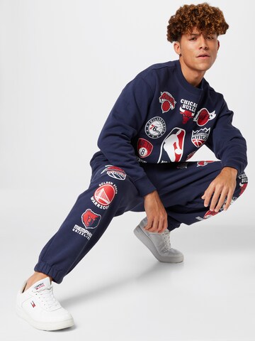 Tommy Jeans Zúžený Kalhoty 'NBA-M17' – modrá