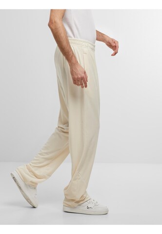 Loosefit Pantalon de sport ' ' Karl Kani en beige