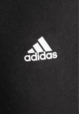 juoda ADIDAS SPORTSWEAR Siaurėjantis Sportinės kelnės 'Essentials Linear Logo'