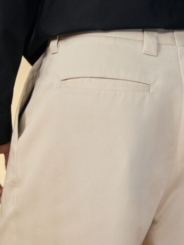 Next Loose fit Pleat-front trousers 'Edit' in Beige