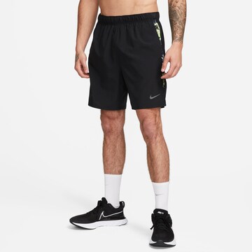 NIKE Regular Workout Pants in Black: front